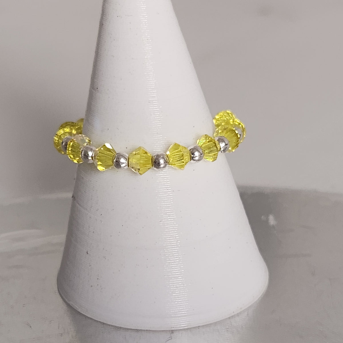 Anillo Sin Fin Biconos Piedras Swarovski 3mm y Plata 925