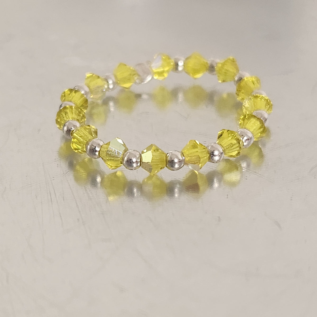 Anillo Sin Fin Biconos Piedras Swarovski 3mm y Plata 925