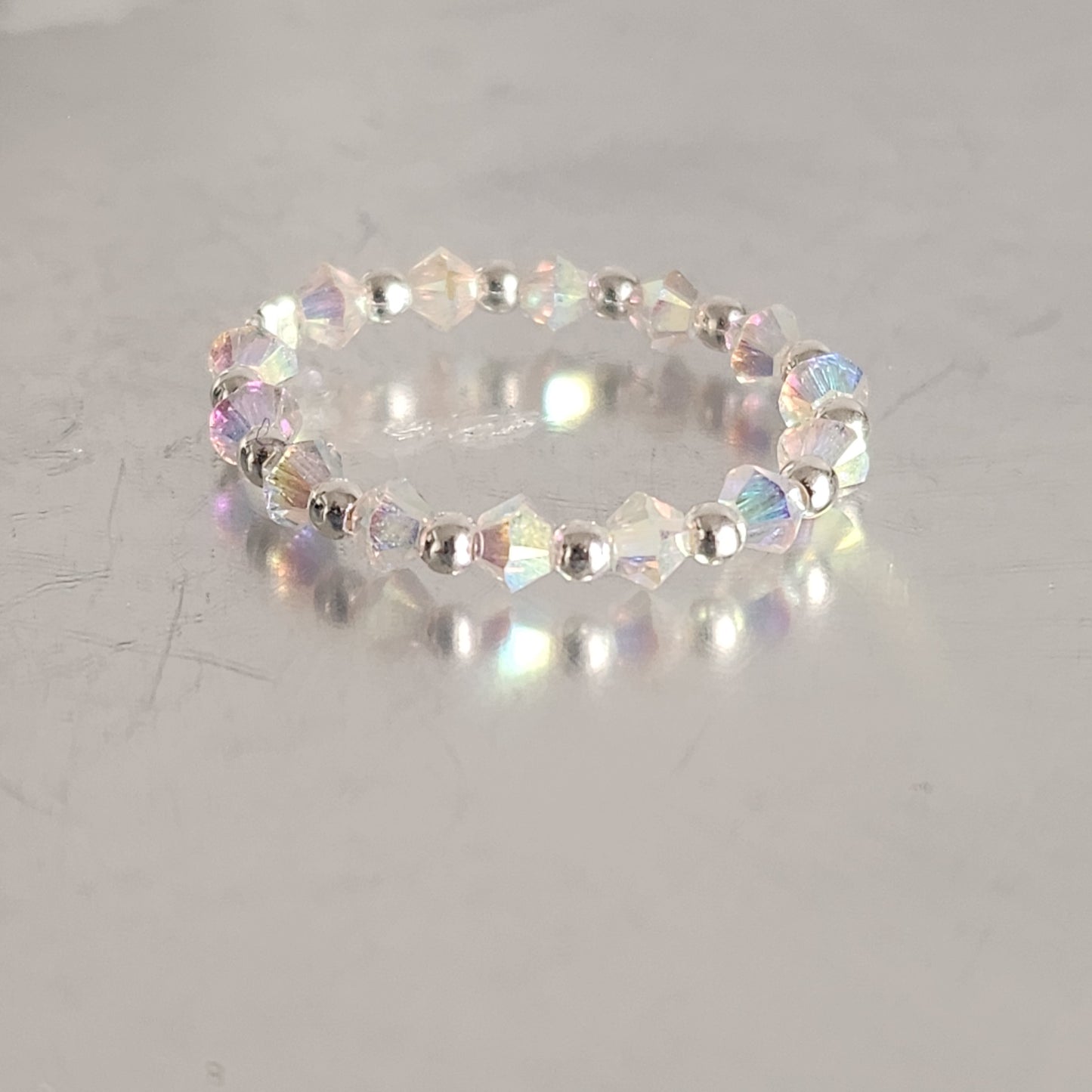 Anillo Sin Fin Biconos Piedras Swarovski 3mm y Plata 925