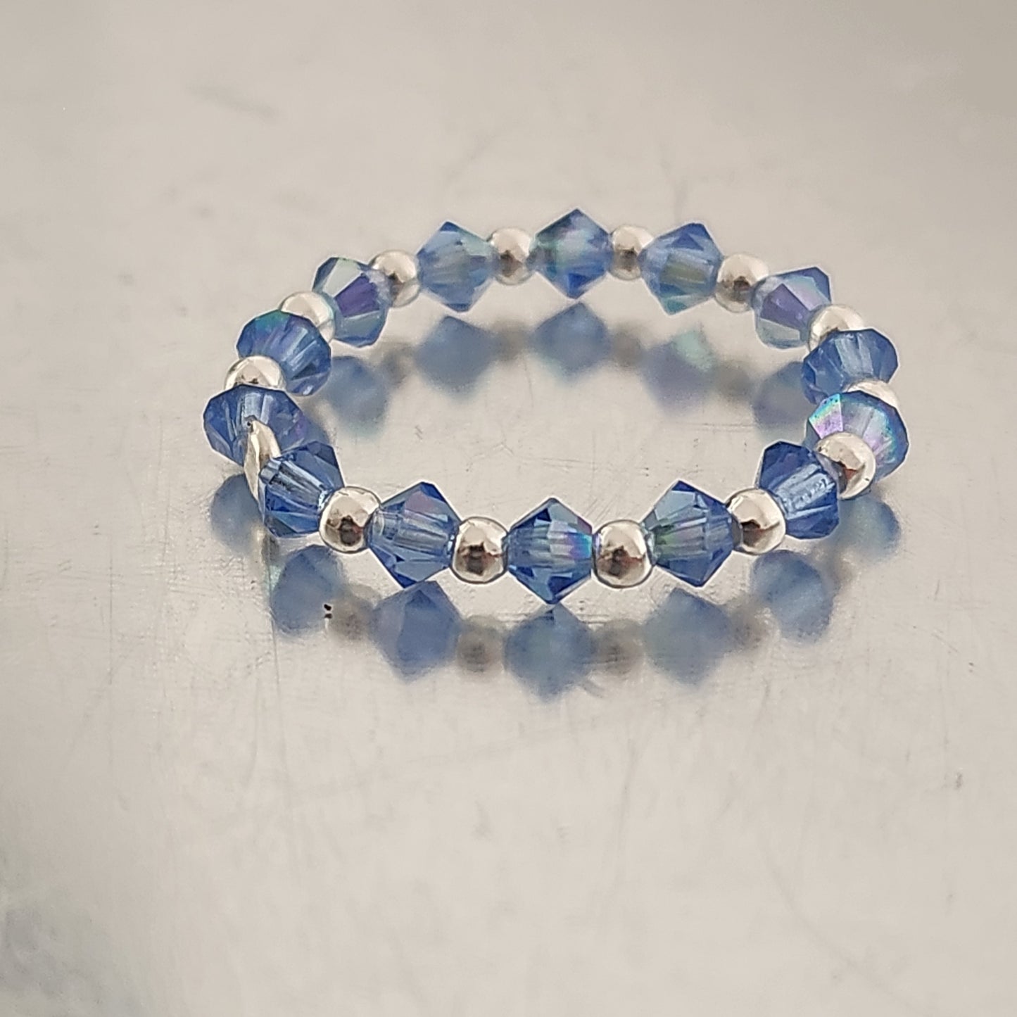 Anillo Sin Fin Biconos Piedras Swarovski 3mm y Plata 925