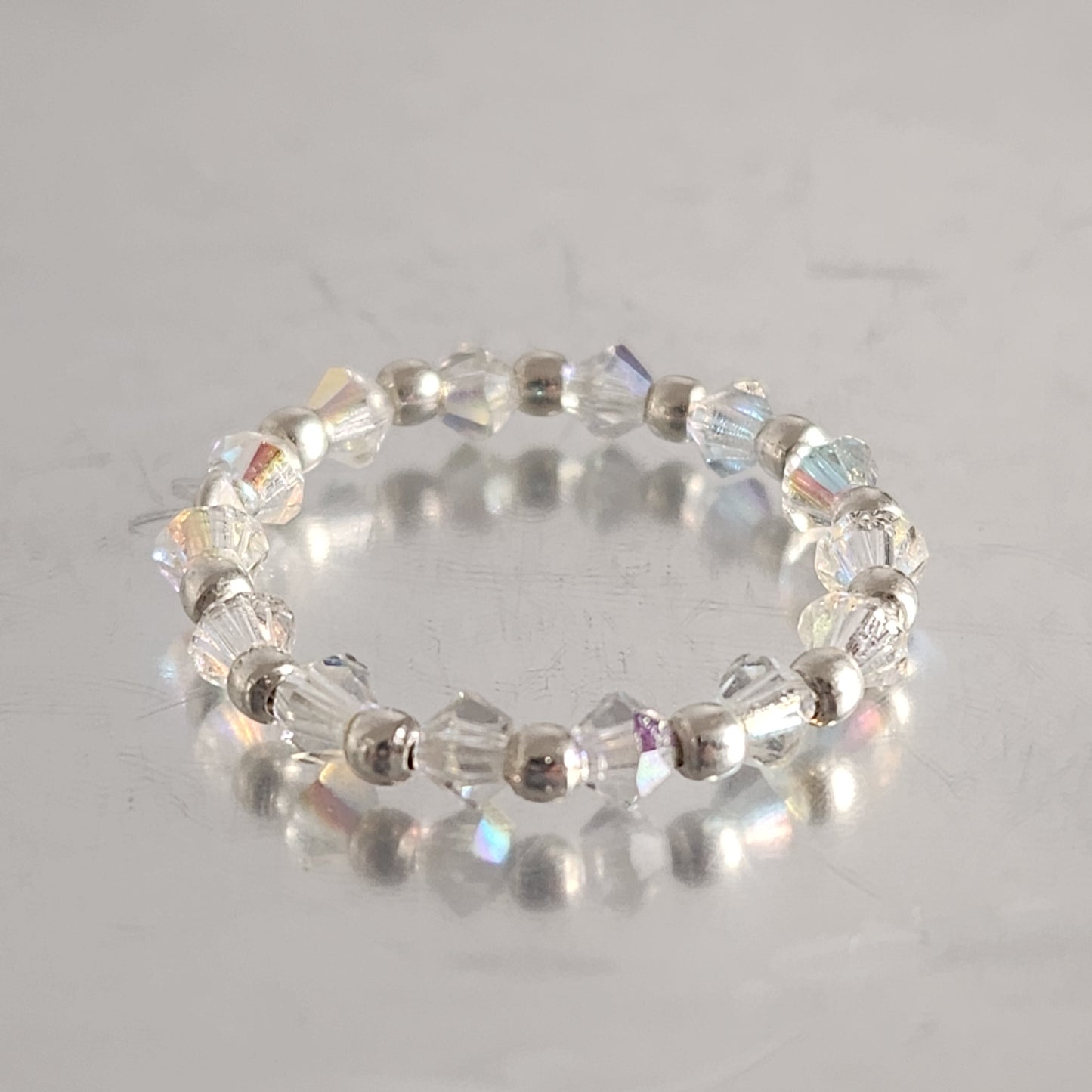 Anillo Sin Fin Biconos Piedras Swarovski 3mm y Plata 925